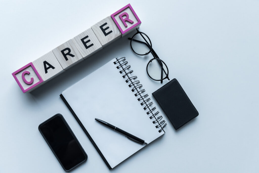 An organized workspace and notebook designed to support a successful career plan.